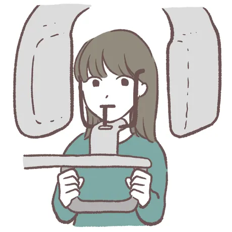歯科用CTで撮影を受ける人のイラスト